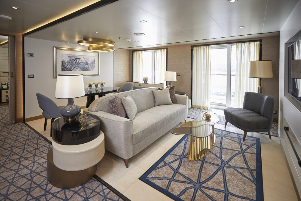 Elegant suite interior on a luxury cruise ship with marble finishes and ocean view balcony