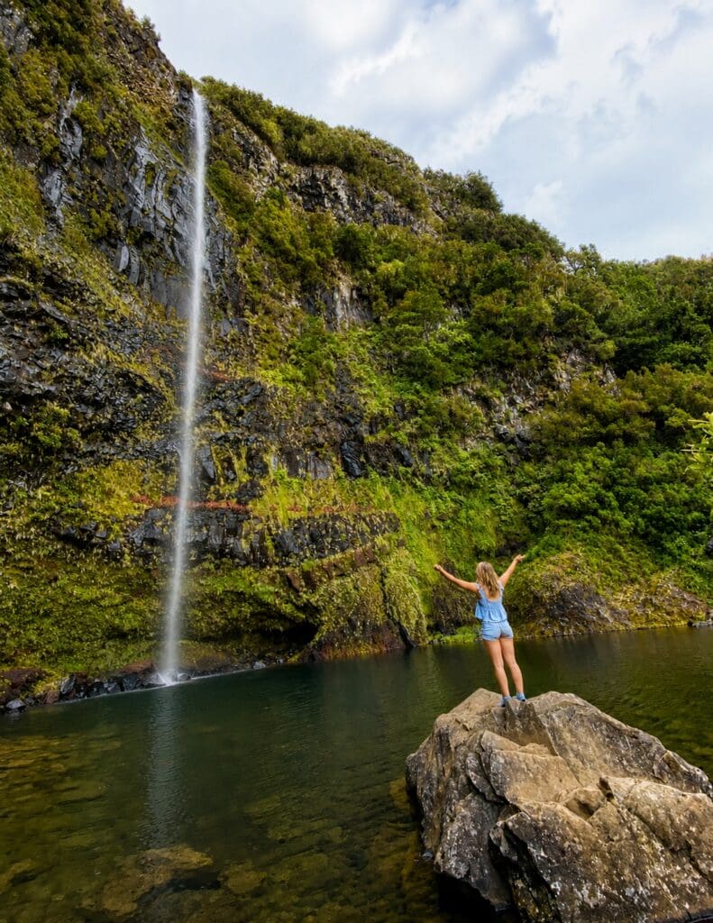 Waterfall surrounded by lush mountain scenery in Madeira's interior.